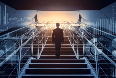 cso_nw_leadership_sucess_businessman_ascending_staircase_surrounded_by_symbols_of_business_acumen_by_metamorworks_gettyimages-957655008-100801476-large